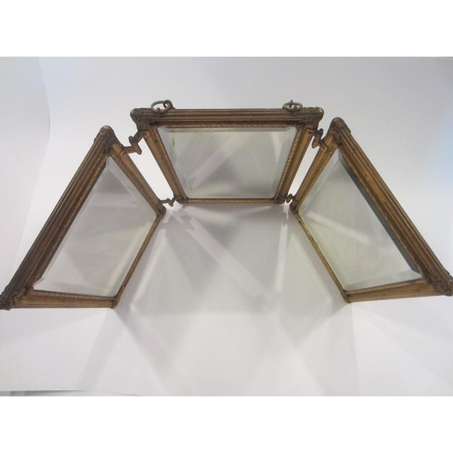 This beveled mirror is a novelty and super attractive. Art deco, French style, gilt bronze, from the past, when people...