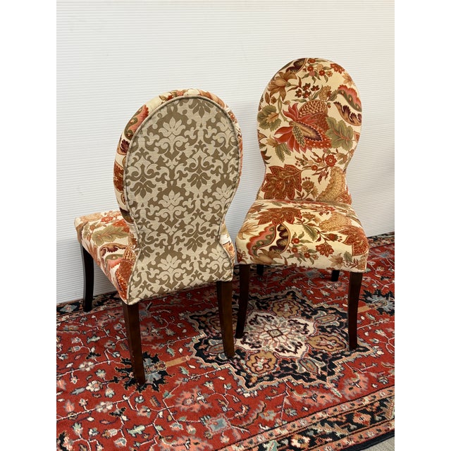 Design Plus Gallery presents a Pair of Floral Side Chairs from Pier 1 Imports Each armless chair has a tall rounded back,...