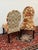 Design Plus Gallery presents a Pair of Floral Side Chairs from Pier 1 Imports Each armless chair has a tall rounded back,...