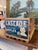 A vintage wooden fruit crate featuring the original "Cascade Brand Washington Apples" label, distributed by the Cashmere...