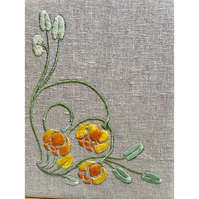 A beautiful Art Nouveau period silk embroidered floral on linen, beautifully framed recently.