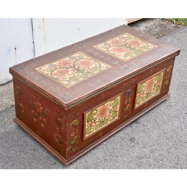 On an oxblood ground is some outstanding tapestry-style decoration of stylized floral and foliate designs. On the front...