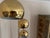 This striking 1970s brass arc floor lamp features three individually adjustable curved arms, three spherical shades and a...