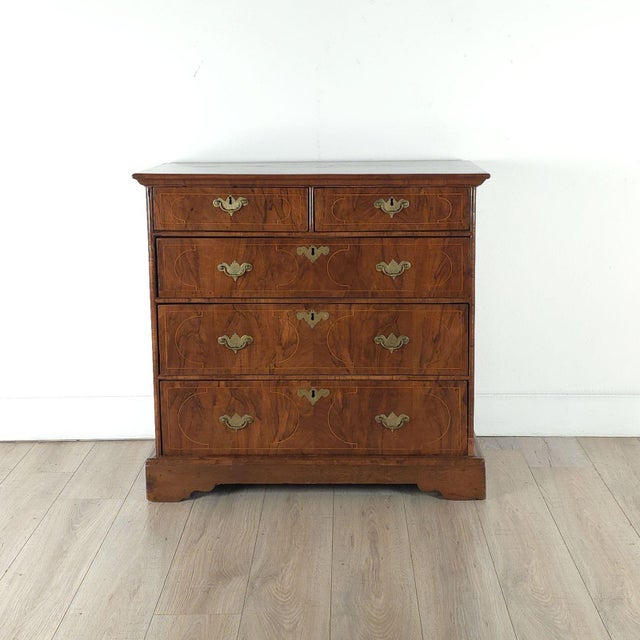 A Queen Anne chest of drawers, England circa 1710.