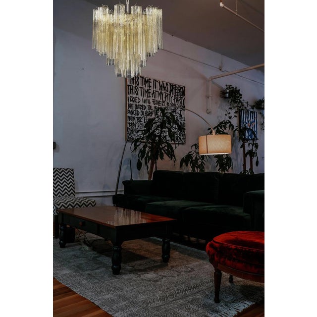 Italian vintage chandelier in Murano glass and nickel-plated metal structure. The armor polished nickel supports 36 large...