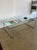 Minimalist bent tubular steel and glass coffee table. 1980s style. Bauhaus-inspired lines with a low architectural...