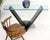 Sharp looking modern design studio made V shape black Italian marble and chrome base with 3/4" rounded corners glass top...