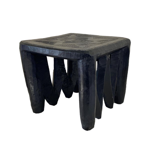 Fabulous Hand carved Wood Stool from the Nupe Tribe of Nigeria. These stools are sculptedd out of a single piece of wood...