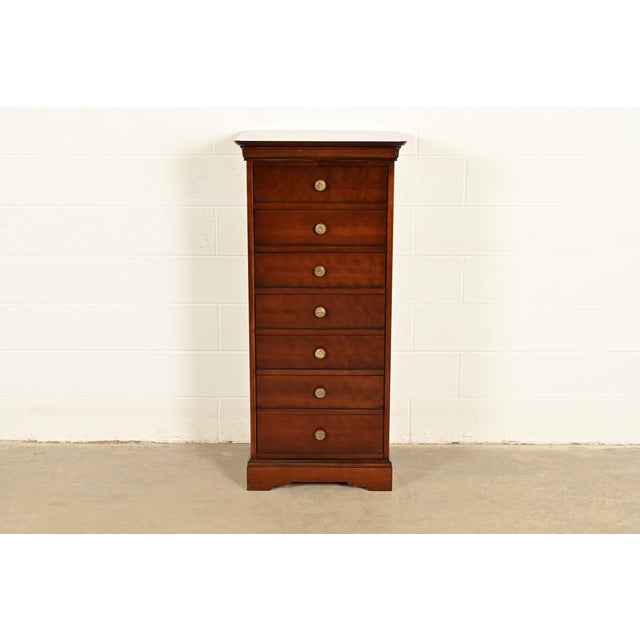 A gorgeous French Louis Philippe style highboy dresser, semainier, or chest of drawers By Grange USA, Circa Late 20th...