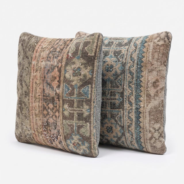 This 20'' x 20'' pillow cover set was made from authentic Turkish rug pieces — muted Oushak medallion bands in teal blue...