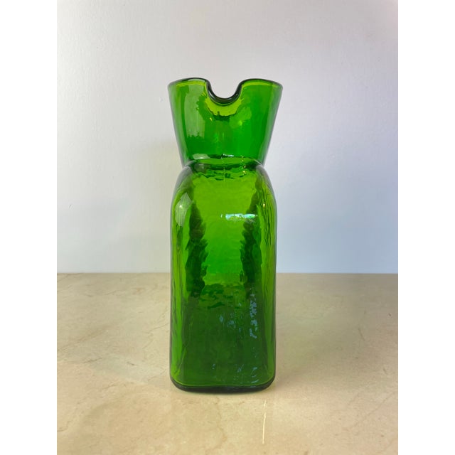Iconic hand-blown glass water bottle by Blenko Glass Company of West Virginia, model #384 — the brand's most recognizable...