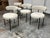 Design Plus Gallery presents a Set of Four Inesse Dining Chairs by Omar De Biaggio for CB2. These ivory dining chairs...