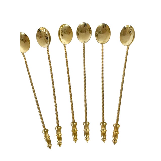 Set of 6 gold plated twisted stem cocktail spoons. Perfect accent for your bar. Sourced in France.