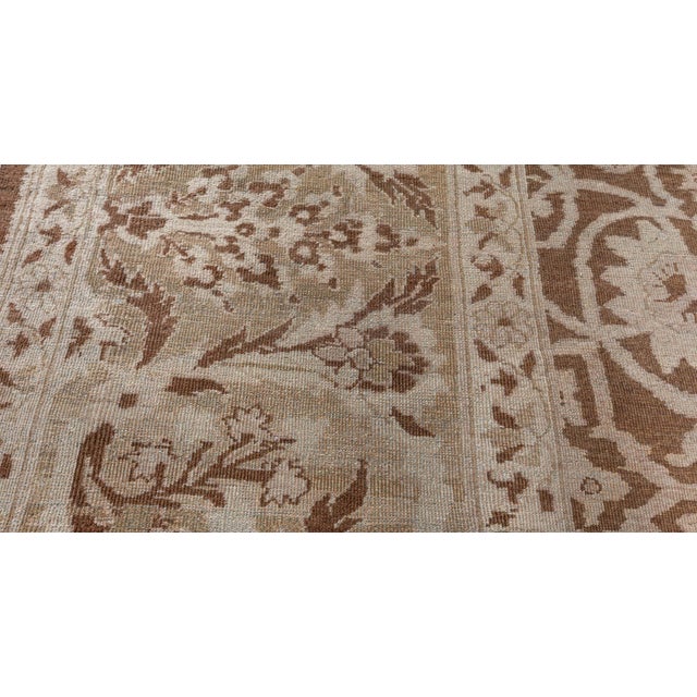 A late 19th century Indian Amritsar antique rug the cocoa field with a sophisticated leafy vine and floral bouquet trellis...