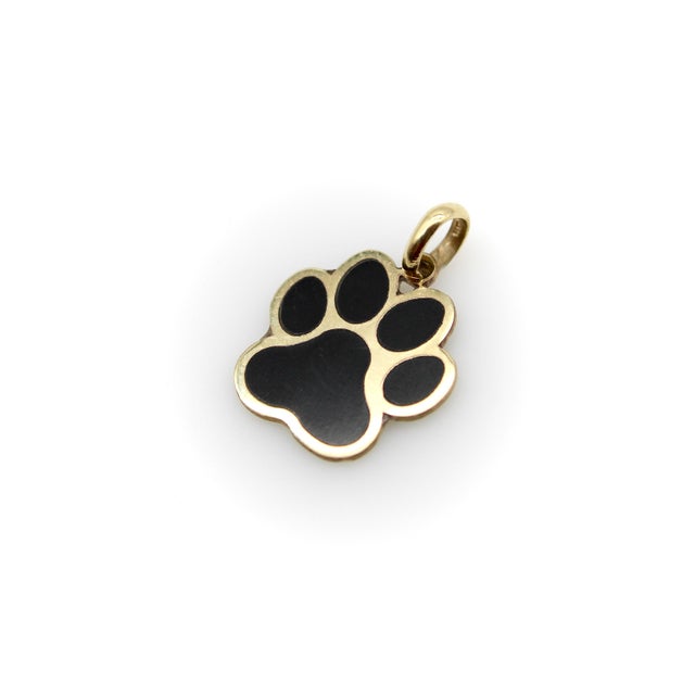 This adorable 14k gold charm features the classic symbol for a dog paw, highlighted by black enamel on both sides. Anyone...