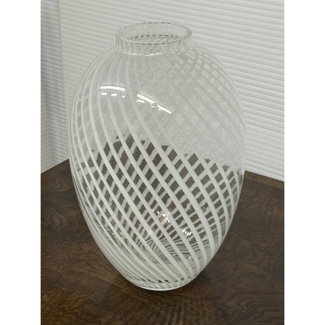 Design Plus Gallery presents a White Spiral or Whirling Vase. The vase has these concentric lines that spiral all around...