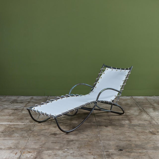 The late 1940s or early 1950s early S-Lounge patio chair by Walter Lamb predating his partnership with Brown Jordan. The...