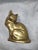 This is a vinntage brass crouching cat statue