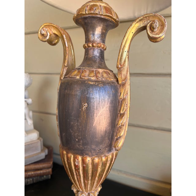 striking Italian giltwood table lamp. Masterfully crafted in Italy, the lamp base is designed in the classic form of an...