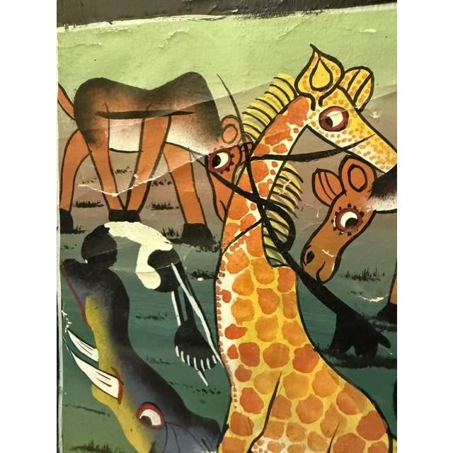 This captivating mid-century style painting is an authentic, highly collectible example of Tanzanian Tingatinga School...