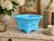 Beautiful vintage Fenton satin blue glass footed jardiniere/cachepot featuring an elegant embossed floral motif and softly...