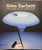 Model 565, a direct light table lamp designed in 1956, features a steel spring that supports the spotlight's reflector....