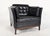 A generous 1960s danish club chair by mogens hansen, retaining its original top grade black leather and built for comfort,...