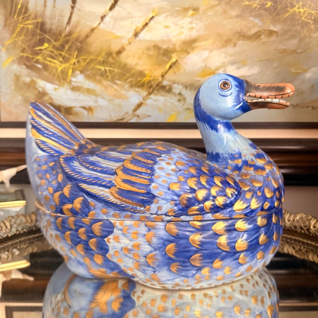 A beautifully hand-painted Italian duck tureen imported by Meiselman Imports of New York, featuring a vibrant cobalt blue...
