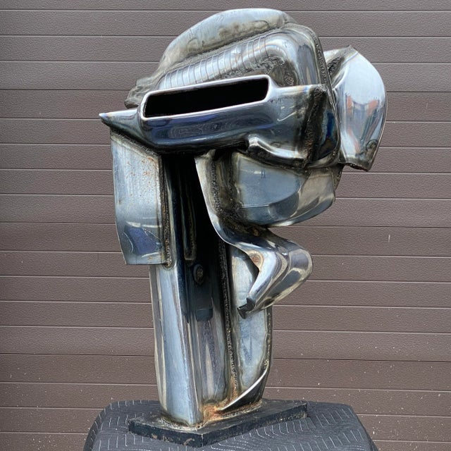 Large scale welded chromium-plated steel salvaged car parts sculpture by artist Jason Seley (1919-1983). Signed by the...