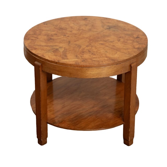 A fine French occasional or low side table from the Art Deco period, featuring a circular top with a striking pie-cut...