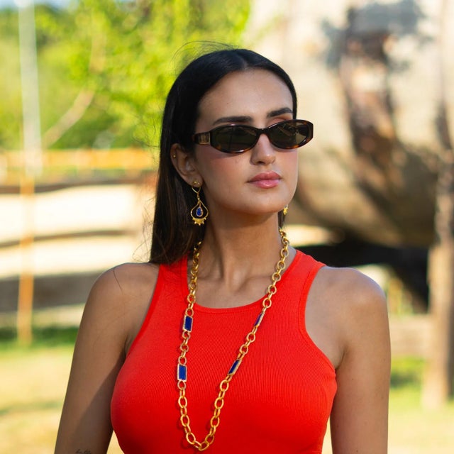 Infuse your style with vibrant charm with the Versatile Glow Blue Cat Eye Gold Long Necklace. Featuring striking blue cat...