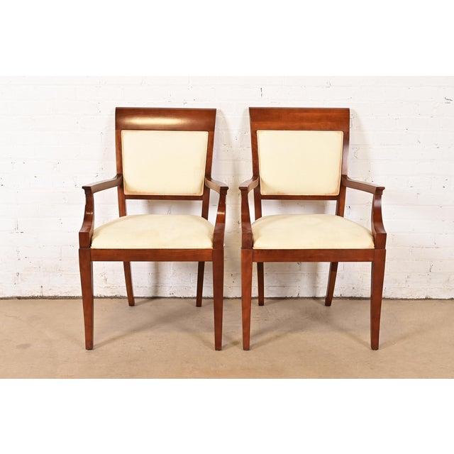 A gorgeous pair of modern Regency style armchairs or dining captain chairs By Baker Furniture USA, Circa Late 20th Century...