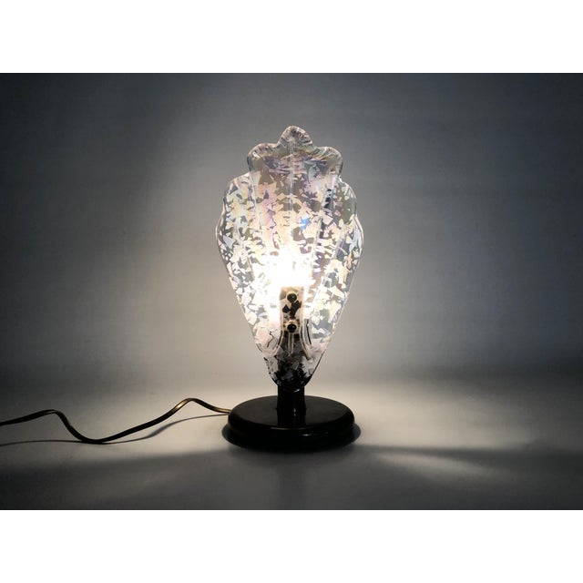 Foliage table lamp in glass and anthracite gray metal. 80 years Anthracite gray metal lamp with a large leaf of pink...