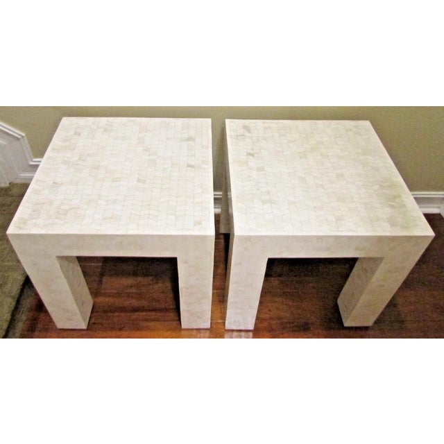 These Matched Pair Tessellated Bovine Bone Parsons Style End Tables from the 1980s are a stunning addition to any indoor...