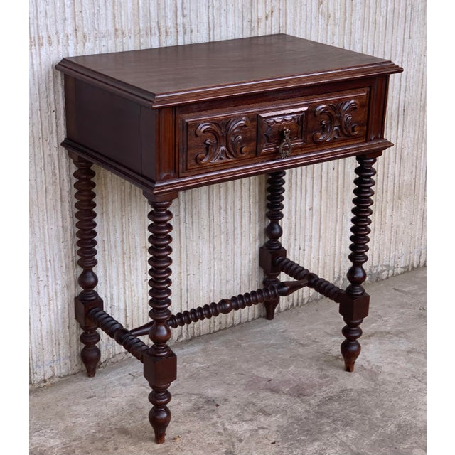 20th century pair of solid carved French nightstands with Turned columns It has one carved drawer and wood T.form...