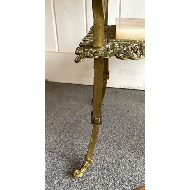 Antique Victorian brass and marble 2-tier plant stand or side table w/ adjustable-height leg bases. Some mild patina to...