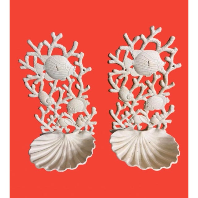 A vintage pair of coastal cast - iron sconces, with intricate design Of fish & shells. A cream color finish could be...