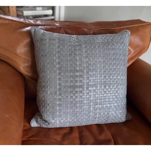 Add refined texture to your space with this Lulu & Georgia decorative pillow, crafted in a soft blue woven leather design....