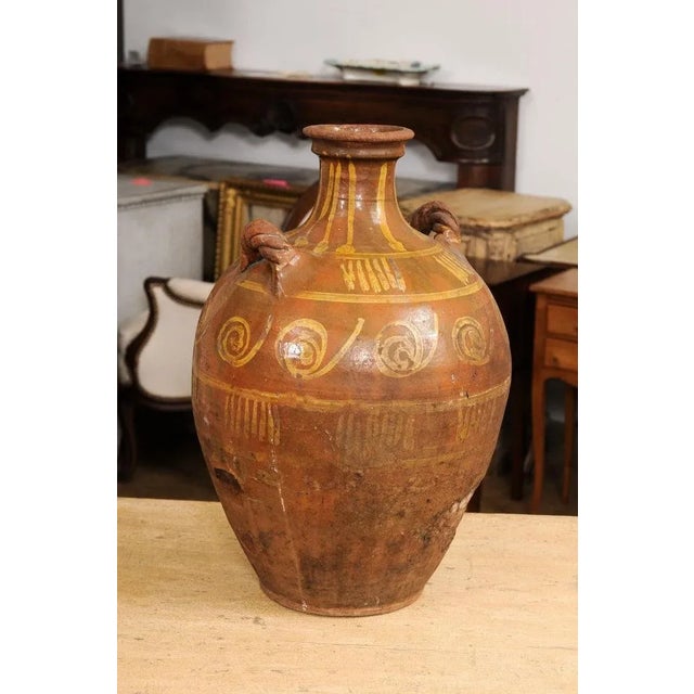 17th Century Italian Terracotta Olive Oil Jar with Yellow Glazed Spiraling Décor For Sale - Image 9 of 13