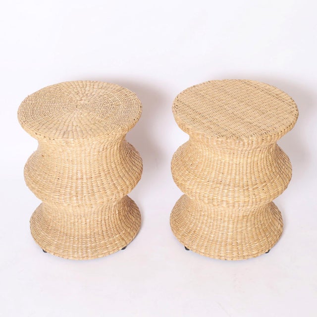 Mid century style spool form stands hand crafted with a sturdy metal frame wrapped in reed.