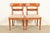 A gorgeous pair of Italian Provincial or English Regency style side chairs or dining chairs By Baker Furniture, "Milling...