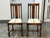 Design Plus Gallery presents a Pair of Antique Jacobean Revival Oak Upholstered Side Chairs. Each chair has a tall slatted...