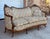 An Early 20th Century Victorian Serpentine Sofa Professionally Reupholstered in a Period Conscious Cream Floral Textile...