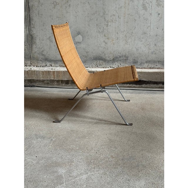 Lounge chair PK22 designed by Poul Kjearholm for Fritz Hansen, Denmark 1955. The chair has a chrome plated steel frame and...