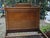 Antique bed in burr wood veneer, showcasing a rich and luminous grain typical of the 19th century. Its panels framed with...