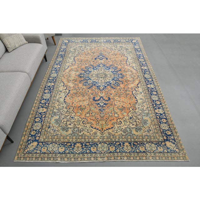 Vintage Turkish Hand-Knotted vintage rug is a semi-antique vintage area rug.'70s Eastern region of Turkey's unique rug is...