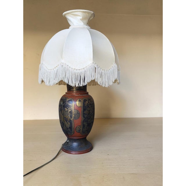 Pair of Japanese vases converted into lamps / Meiji era (late 19th century). The metalwork is richly decorated with floral...