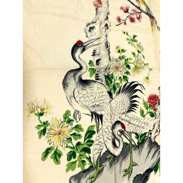 This vintage silk panel curtain features an exquisite scene of two cranes beneath a pine tree, surrounded by blooming...