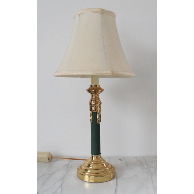 Vintage green candlestick style lamp with brass tassel accents. No makers mark. Minor age wear. Wired and in working...