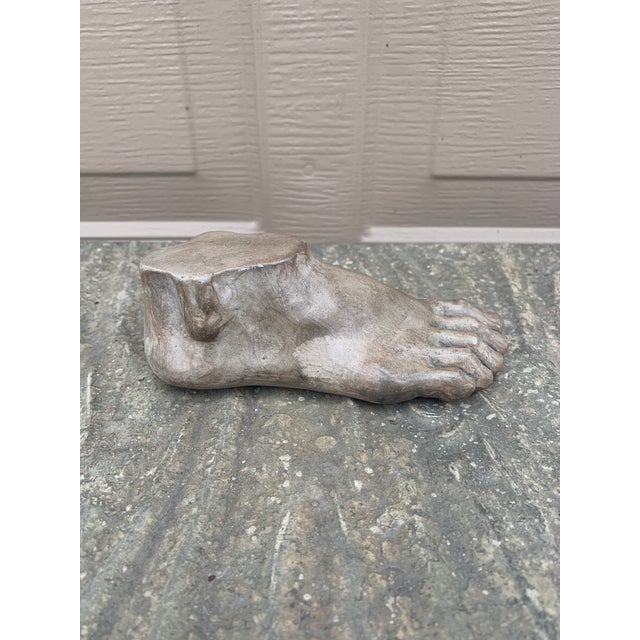A gorgeous Grand Tour style cast plaster sculpture of an Ancient Greek or Roman foot USA, Late 20th Century Measures:...